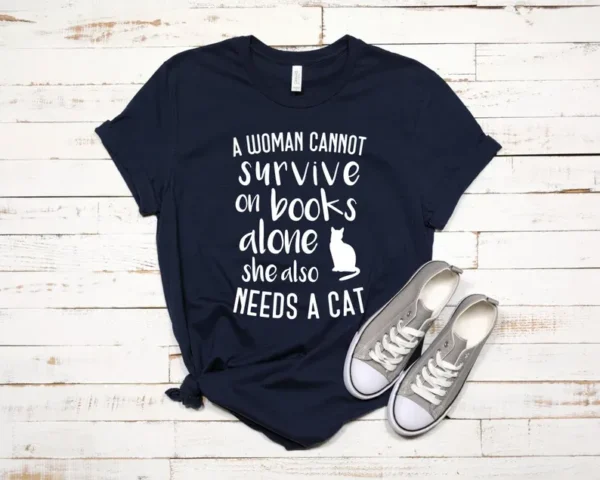 A Woman Cannot Survive On Books Alone – Book Lover – Cat Lover